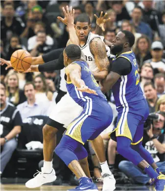  ?? Lower two photos by Tom Reel / San Antonio Express-News ?? LaMarcus Aldridge is swarmed by Draymond Green (right) and Andre Iguodala. The Spurs forward finished with 18 points and 10 rebounds to lead San Antonio.