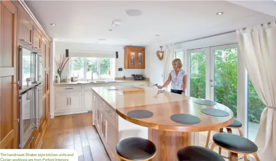  ??  ?? The handmade Shaker style kitchen units and Corian worktops are from Pyrford Interiors