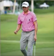  ?? MARCO GARCIA — THE ASSOCIATED PRESS ?? Justin Thomas reacts to his birdie putt on the 18th green to finish his third round at the Sony Open on Saturday.