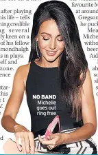  ??  ?? NO BAND Michelle goes out ring free