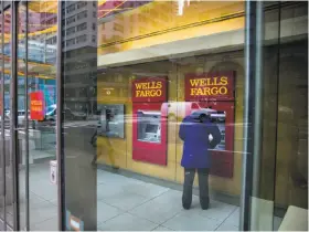  ?? Sam Hodgson / New York Times ?? More than 30 major banks, including Wells Fargo, have created a network called Zelle that allows users to instantly send money to one another.
