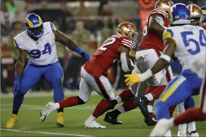  ?? JANE TYSKA — BAY AREA NEWS GROUP ?? The 49ers’ Jeff Wilson Jr. carries against the Los Angeles Rams last week, one of 44carries for the 49ers for 156yards rushing.