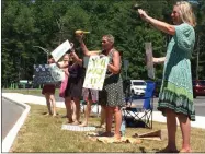  ?? GLENN GRIFFITH — MEDIANEWS GROUP ?? Shen teachers give a final goodbye to members of the Class of 2020 as they exit the school campus after graduation.