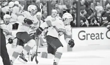  ?? DAN HAMILTON USA TODAY NETWORK ?? Panthers forward Nick Cousins is chased by teammates after scoring the series-winning goal in overtime Friday, sending Florida to the Eastern Conference finals against the Carolina Hurricanes.