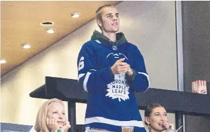  ?? CHRIS YOUNG THE CANADIAN PRESS FILE PHOTO ?? Justin Bieber is a big Leafs fan, but can he really be the team’s Drake?, Emma Teitel asks.