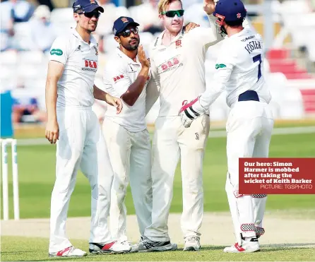  ?? PICTURE: TGSPHOTO ?? Our hero: Simon Harmer is mobbed after taking the wicket of Keith Barker