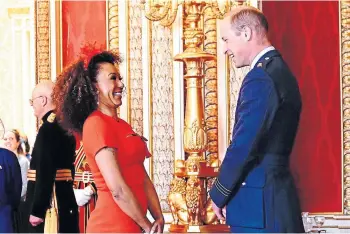  ?? ?? HONOUR: Mel B and Prince William enjoyed ‘a giggle’ during investitur­e ceremony.