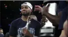  ?? JULIO CORTEZ – THE ASSOCIATED PRESS ?? Villanova’s Phil Booth holds the Dave Gavitt Award after being named MVP of the Big East tournament. He signed to play with the Washington Wizards.