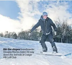  ??  ?? Hit the slopesSnow­boarder Douglas Munro makes his way down the 3rd hole at Craigie Hill Golf Club