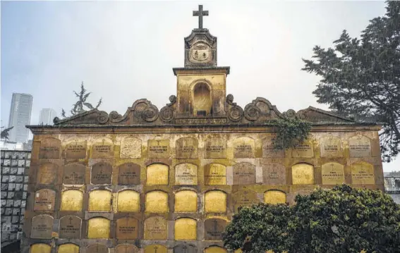  ?? Federico Rios Escobar photos / The New York Times ?? Walk the paths of Cementerio Central, and you’ll see ornate mausoleums and statues, locals lighting candles, and the faithful leaving flowers at the feet of a Virgin Mary statue.