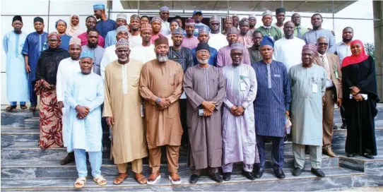  ?? ?? Some members of the 2023 Hajj National Media Team with the NAHCON Chairman/ CEO, Alhaji Zikrullahi Kunle Hassan ( middle - front row) and board members of the commission after the inaugurati­on of the media team in Abuja... yesterday.