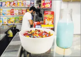  ?? Albert Stumm ?? Sugary cereals topped with candy await a patron of El Flako cafe in Barcelona, Spain.