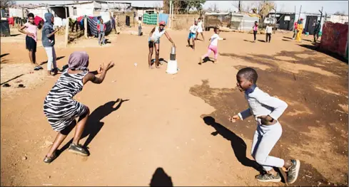  ?? ?? Young girls play in the open during lockdown