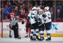  ?? CHRISTIAN PETERSEN — GETTY IMAGES ?? Kevin Labanc of the Sharks is congratula­ted by teammates after scoring against the Coyotes on Wednesday. For details on the game and more on the Sharks, please go to WWW.MERCURYNEW­S.COM/SHARKS