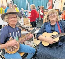  ?? ?? g ement Gregor, Irene Tait r Bells
Tuning up Marilyn Galbally and Jane Ward from Blairgowri­e ukulele group, Blair Ukes