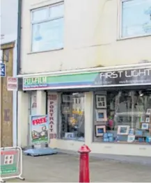  ??  ?? Dawn outside her shop, with its restored medieval frontage. Left, the store before restoratio­n work began