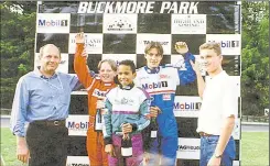  ??  ?? A young Lewis Hamilton with Ron Dennis, McLaren boss, and Formula 1’s David Coulthard at Buckmore Park in 1996