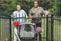  ?? WILLIAM WIDMER/ THE NEW YORK TIMES ?? Betty Boatner, left, and Thurman Byrd stand at the grave of their brother, James Byrd Jr., in the Jasper City Cemetery, in Jasper, Texas. The family of Byrd, a Texas man dragged to his death in 1998, is working to preserve the memory of a racially...