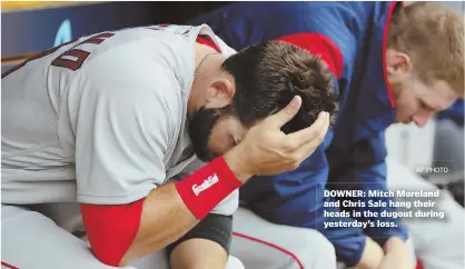  ?? AP PHOTO ?? DOWNER: Mitch Moreland and Chris Sale hang their heads in the dugout during yesterday’s loss.