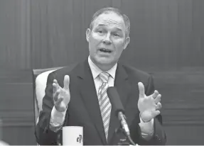  ??  ?? In this June 13, 2013, file photo, then-Oklahoma Attorney General Scott Pruitt gestures as he answers a question during a news conference in Oklahoma City. Newly obtained records show Pruitt’s penchant for travel and concerns about security was notable...