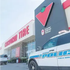  ??  ?? Regina Police Service vehicles outside the east Canadian Tire.