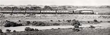  ??  ?? A view over the landscape near Beaulieu Road of 'West Country' No. 34103 Calstock with the 10.00 Bradford Exchange-Poole train on June 24, 1961.
