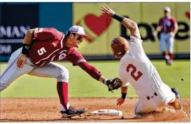  ?? STEVE SISNEY / THE OKLAHOMAN ?? UT infielder Kody Clemens is tagged out at second base by Oklahoma’s Kyle Mendenhall during Thursday’s 3-1 loss.