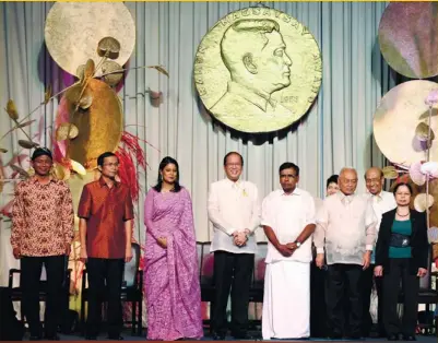  ?? (AFP FOTO) ?? POWER ROSTER. President Benigno Aquino III (center) with Ramon Magsaysay Awardees (from left) Ambrosius Ruwindrija­rto of Indonesia, Yang Saing Koma of Cambodia, Syeda Rizwana of Bangladesh, Kulendei Francis of India,Romulo Davide of the Philippine­s and...