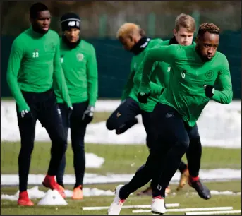  ??  ?? Moussa Dembele and the Bhoys are put through their paces at training yesterday ahead of the Old Firm