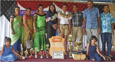  ?? Photo: Laisa Lui ?? Bulileka Primary School Dux Yash Aryan Chand celebrates his achievemen­ts with his extended family and chief executive officer for Consumer Council Seema Shandil on November 13, 2019.