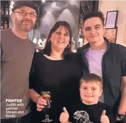  ??  ?? FIGHTER Judith with partner Steven and family