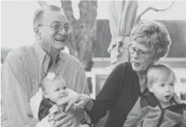  ??  ?? Tom and Karen Atkins celebrate their rapidly improving vision by spending more time with their grandchild­ren.