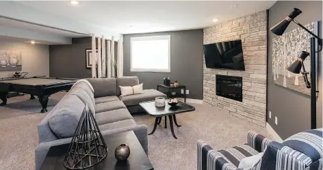  ??  ?? Purchasers can opt to have North Ridge profession­ally develop the basement of their Highlander Ridge II home, effectivel­y doubling their living space. The show home’s lower level features an inviting family room, guest bedroom, home office, full...