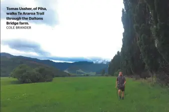  ?? COLE BRANDER ?? Tomas Ussher, of Piha, walks Te Araroa Trail through the Daltons Bridge farm.