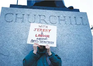  ?? (Henry Nicholls/Reuters) ?? SUPPORTERS OF Labour attend a demonstrat­ion last year organized by the British Board of Jewish Deputies for those who oppose antiSemiti­sm, in Parliament Square in London.