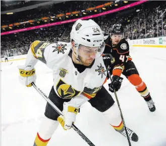  ?? Richard Brian ?? Las Vegas Review-journal @vegasphoto­graph Vegas Golden Knights center Oscar Lindberg (24) and Anaheim Ducks defenseman Hampus Lindholm (47) vie for the puck during the first period of an NHL game Monday at T-mobile Arena.