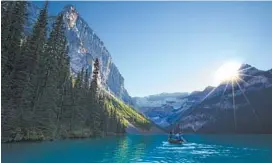  ??  ?? Canoeing on Lake Louise in Banff National Park