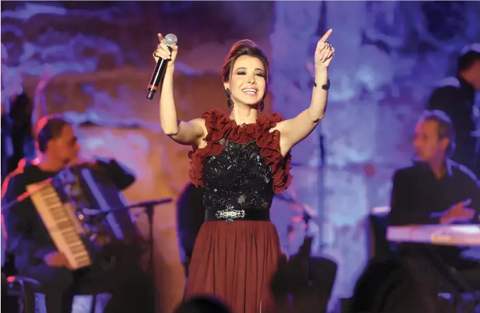  ?? Getty ?? Lebanese singer Nancy Ajram at the 53rd Internatio­nal Carthage Festival in Tunisia in 2017. Her stage actions can often be restricted to only a few shimmies and air claps