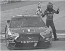  ?? PETER CASEY/USA TODAY SPORTS ?? Kevin Harvick celebrates winning the Drydene 311 on Sunday at Dover Internatio­nal Speedway.