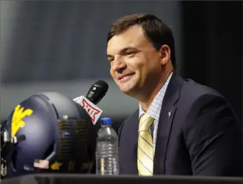  ?? Associated Press ?? NEW GUY IN ( MORGAN) TOWN For the first time since 2011, someone other than Dana Holgorsen manned the podium for West Virginia at Big 12 media days Tuesday in Arlington, Texas. Neal Brown, hired to replace Holgorsen, made his media days debut preaching patience for a young Mountainee­rs team.