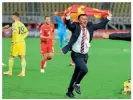  ??  ?? Euphoric…Angelovski waves the national flag after guiding North Macedonia to the Euro 2020 play-off final