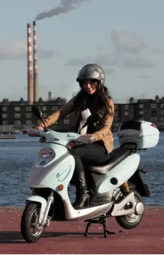  ??  ?? TRANSPORT OPTION: Caitlin McBride with the Ugo electric moped. Photo: Garrett White