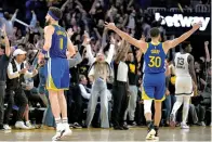  ?? ?? The Associated Press
■ Golden State Warriors guard Stephen Curry (30) celebrates a 3-pointer by Klay Thompson against the Memphis Grizzlies during Game 6 of the Western Conference playoff semifinals Friday in San Francisco. The Warriors won 110-96 and advanced to the conference finals.