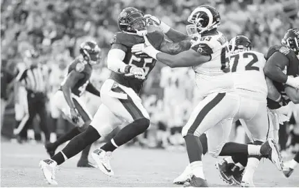  ?? LLOYD FOX/BALTIMORE SUN ?? Ravens linebacker Terrell Suggs (55), battling the Rams' Darrell Williams in the preseason, begins his 16th season in the NFL today.