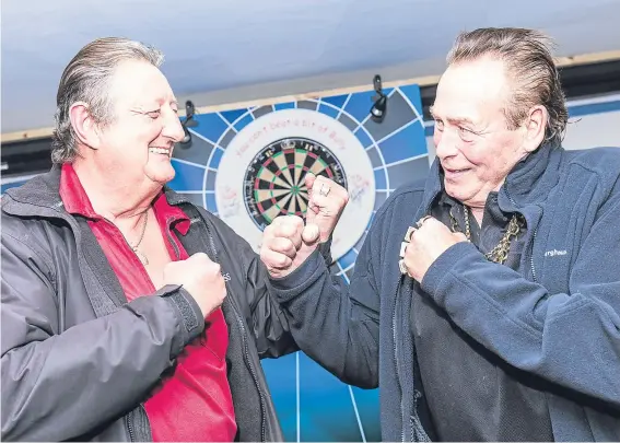  ??  ?? Two of sport’s most flamboyant characters, Eric Bristow and Bobby George, back together in the unlikelies­t of settings on the Isle of Lewis