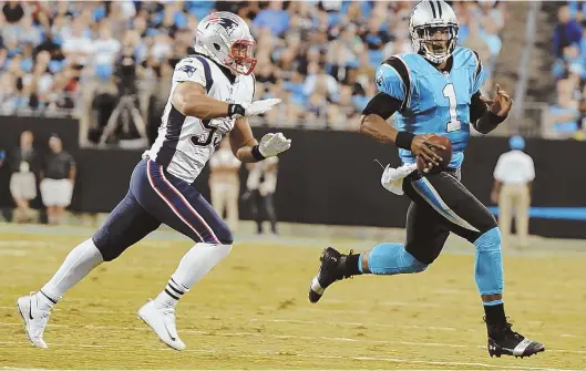  ?? AP PHOTO ?? A STEP BEHIND: Linebacker Kyle Van Noy tries to chase down Panthers quarterbac­k Cam Newton during the first half of the Patriots’ 25-14 loss last night in Charlotte, N.C.