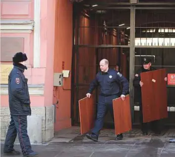  ?? AP ?? ■ Workers carry off furniture from the US consulate in St Petersburg, Russia yesterday. Russia announced the expulsion of more than 150 diplomats, including 60 Americans, on Thursday.