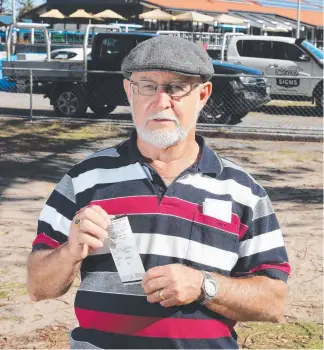  ?? Picture: RICHARD GOSLING ?? Lawn bowler Rob Harris from Mackay outside Broadbeach Bowls Club, where he copped a $252 parking fine.
