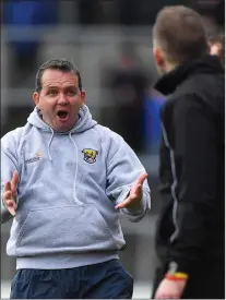  ??  ?? Davy Fitzgerald shows his displeasur­e to the fourth official during Sunday’s league clash with Kilkenny in Nowlan Park.