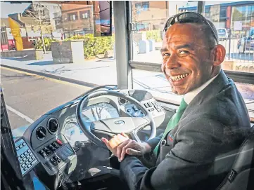  ??  ?? CHARGED UP: Jonathan Eggleton tests the fully-electric bus. Picture by Mhairi Edwards.